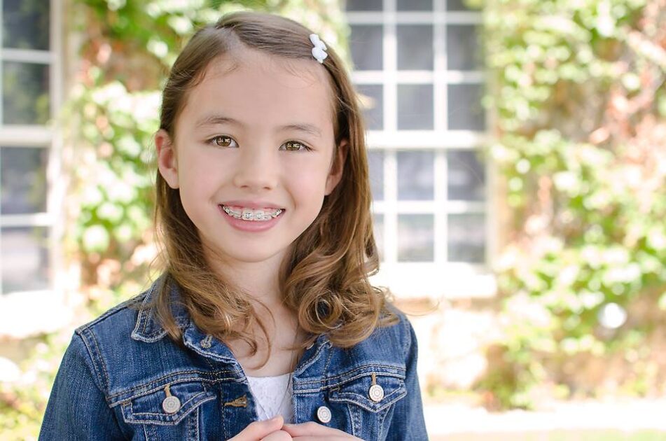 Child receiving orthodontic treatment in Frisco, TX by Dr. Do-deLatour