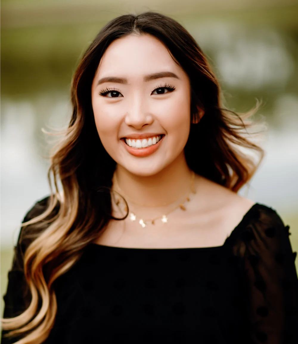 Smiling woman with blonde highlights posing for photo | Frisco's Premier Orthodontics
