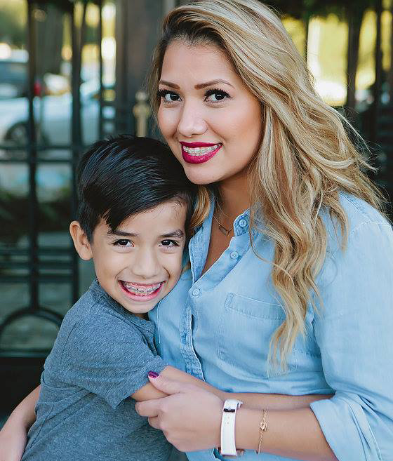 Smiling mom and son with braces posing for photo | Frisco's Premier Orthodontics
